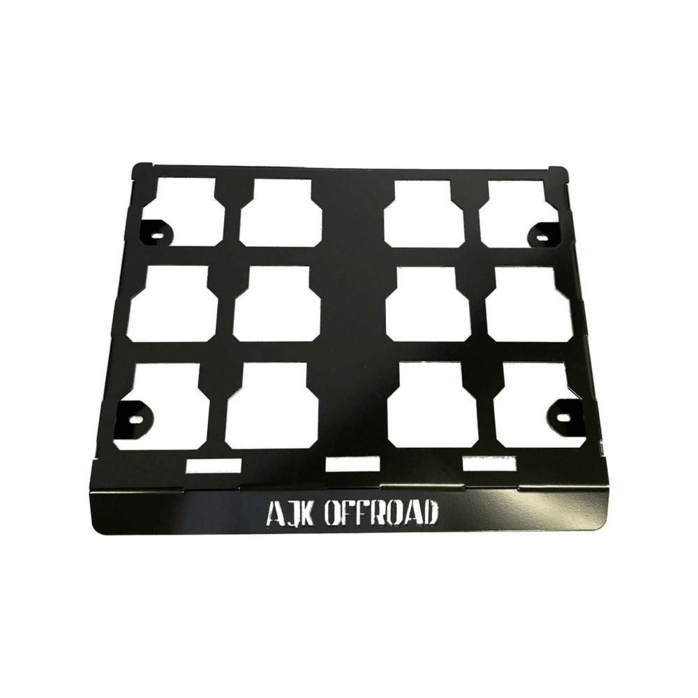 The Universal Milwaukee Packout Mount 1.0 by AJK Offroad is a black CNC laser-cut metal bracket with AJK OFFROAD text, featuring multiple cut-out squares and four corner mounting holes for perfect compatibility with a Milwaukee Packout Mount.